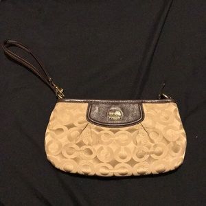 Cute cream colored coach larger wristlet